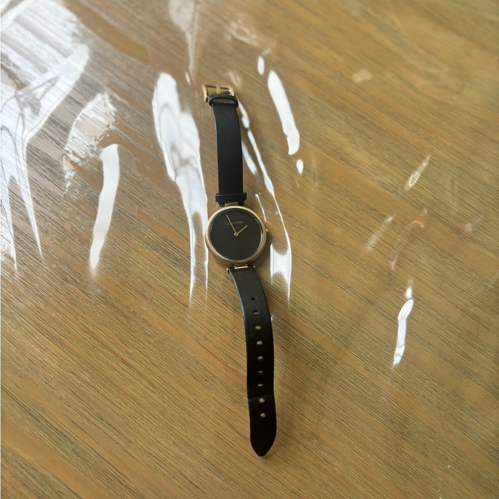 Calvin Klein Black and Gold Women's Watch